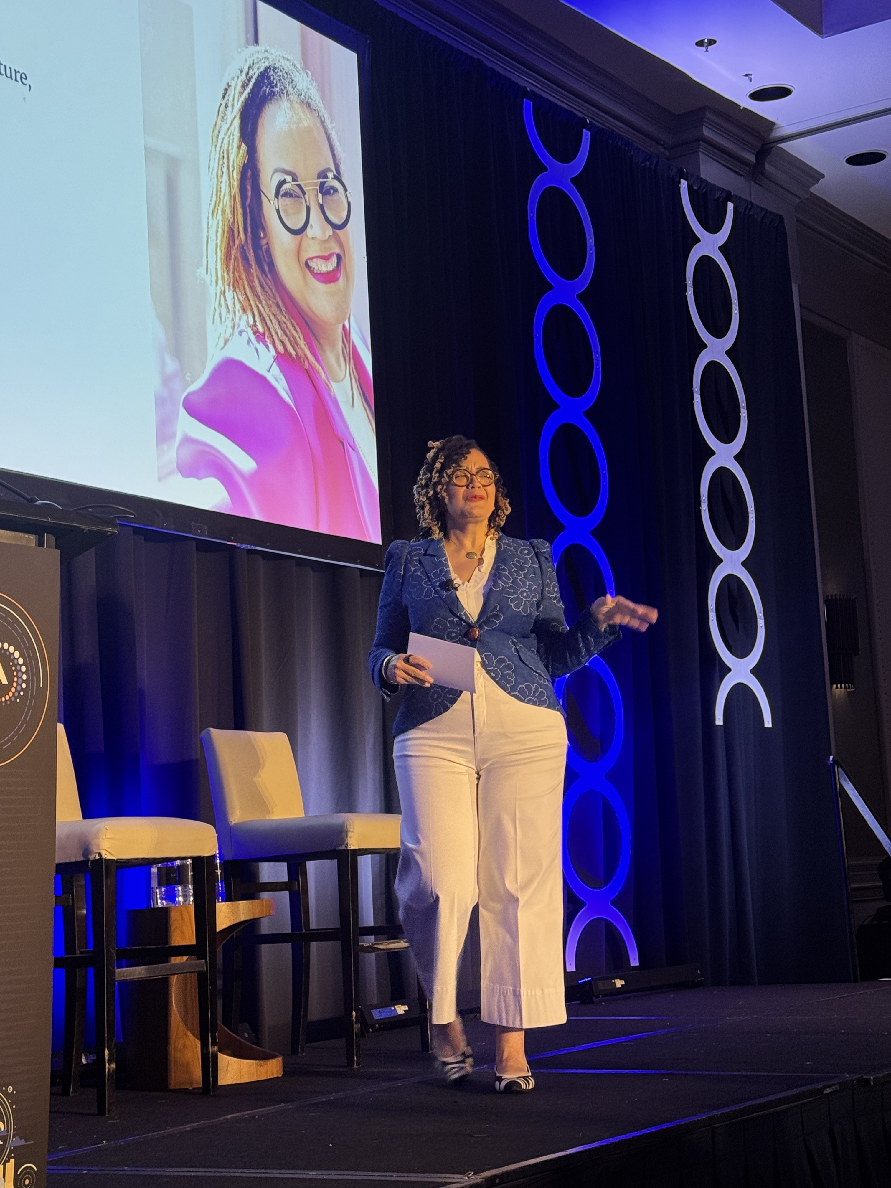Tash Durkins speaking on stage at the FTA conference