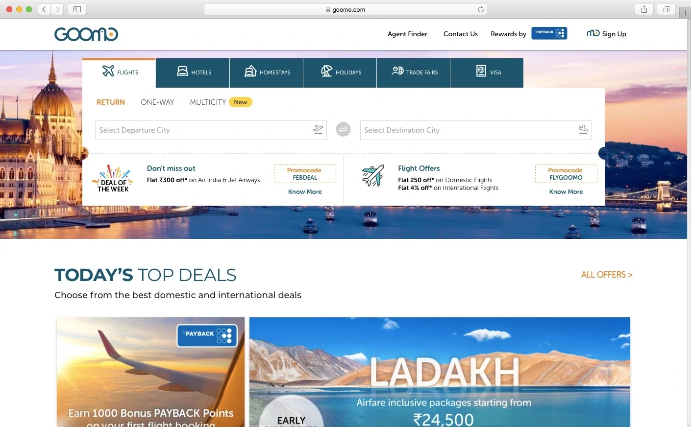 Goomo desktop travel-booking homepage with search fields and travel deals.