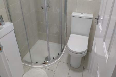 Small toilet and shower installation by QuoteBeating.co.uk.