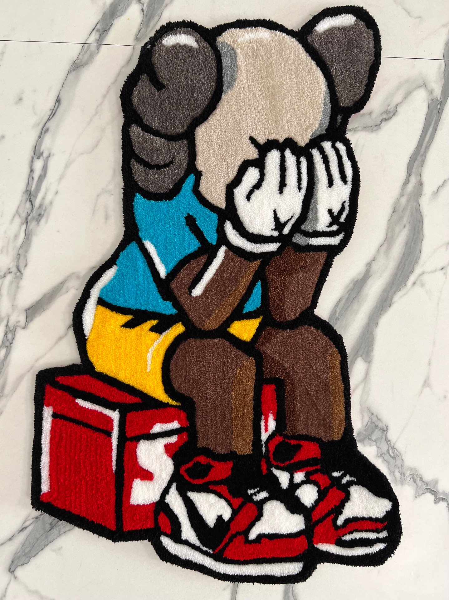“Kaws x Supreme”