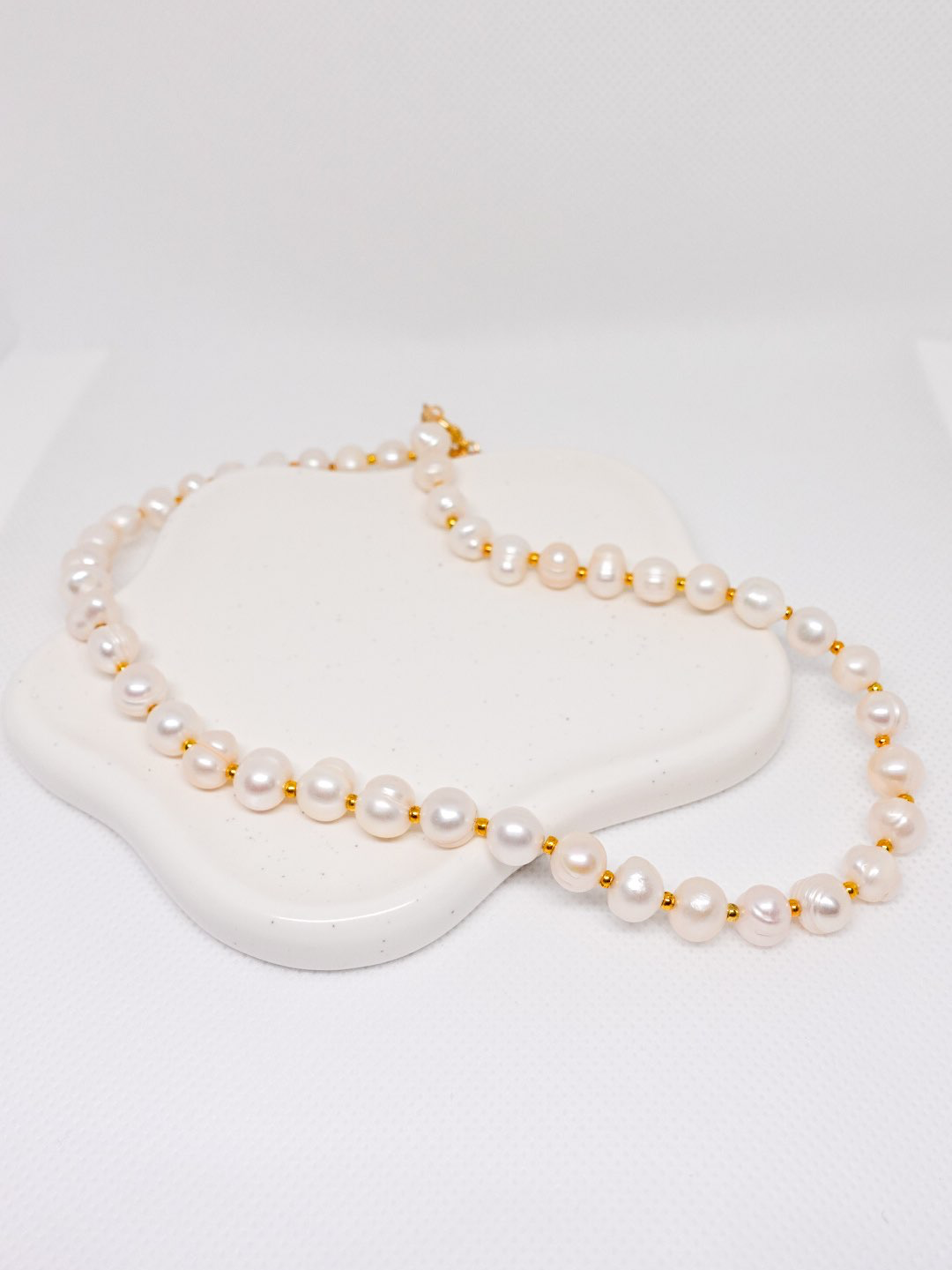 שרשרת פנינים - Tal