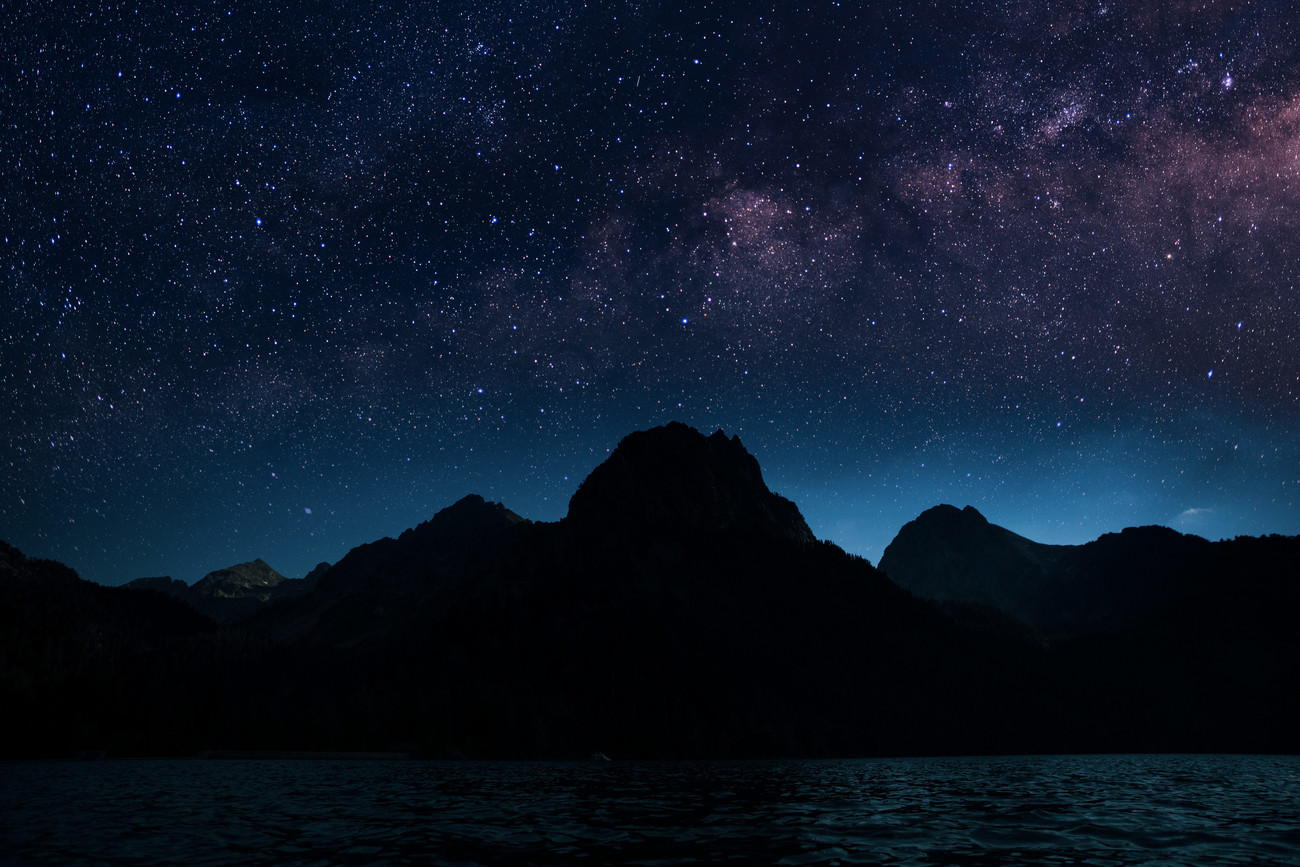 Art Photography Astrophotography picture of Sant Mauricio landscape with  milky way on the night sky.