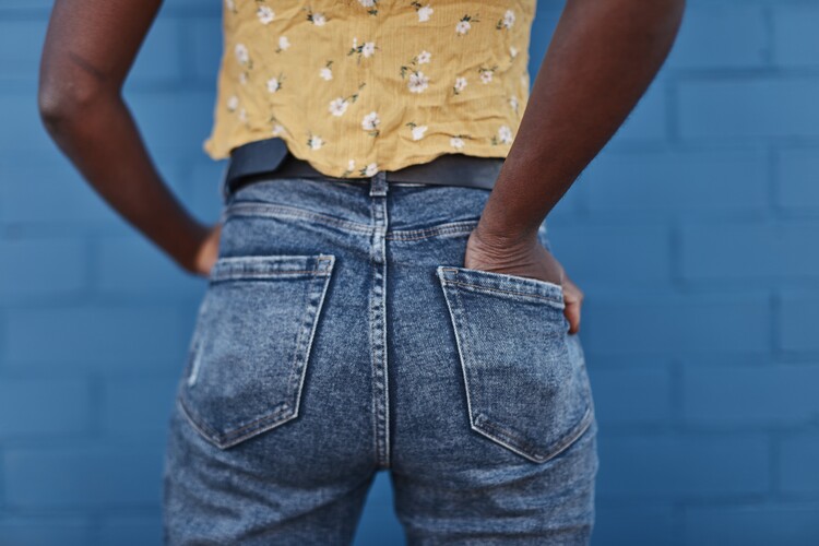 Art Photography jeans over blue wall