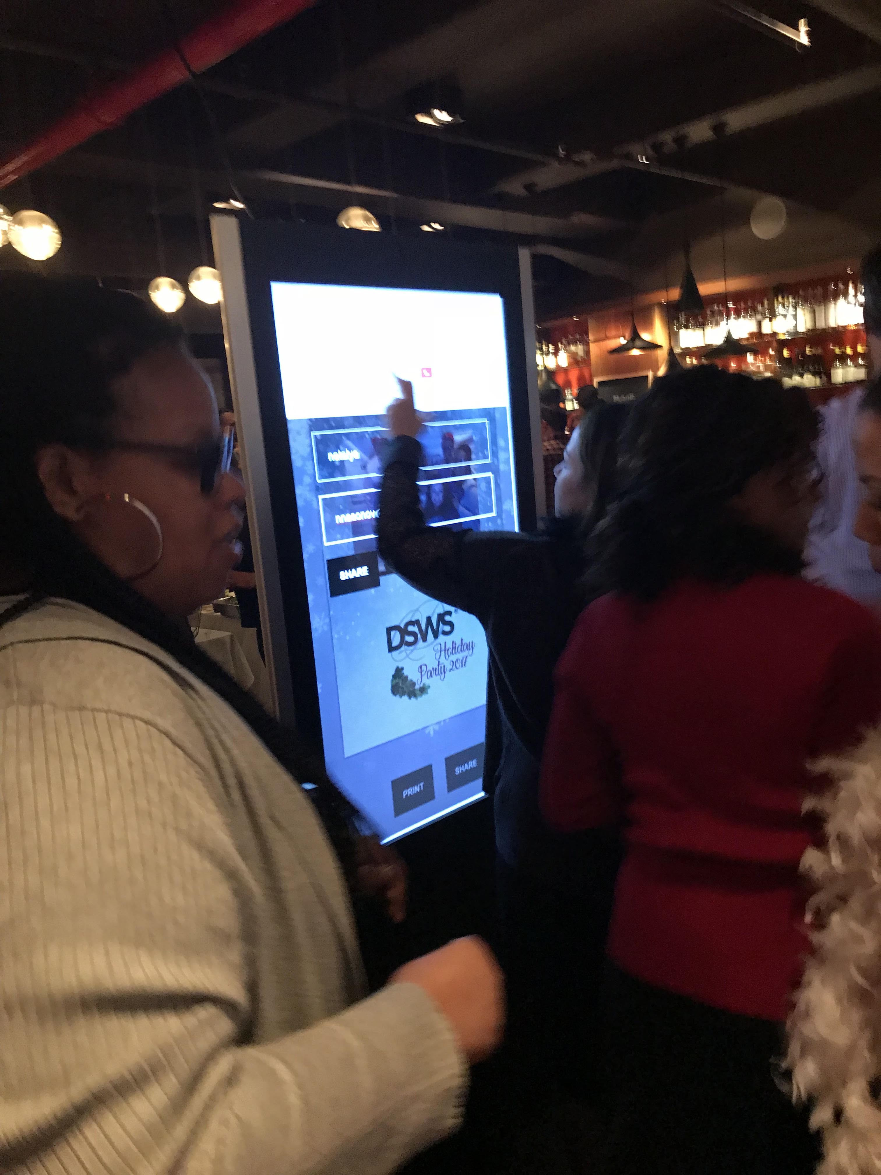 Guest using 49 inch kiosk at event