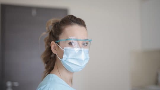 woman wearing PPE