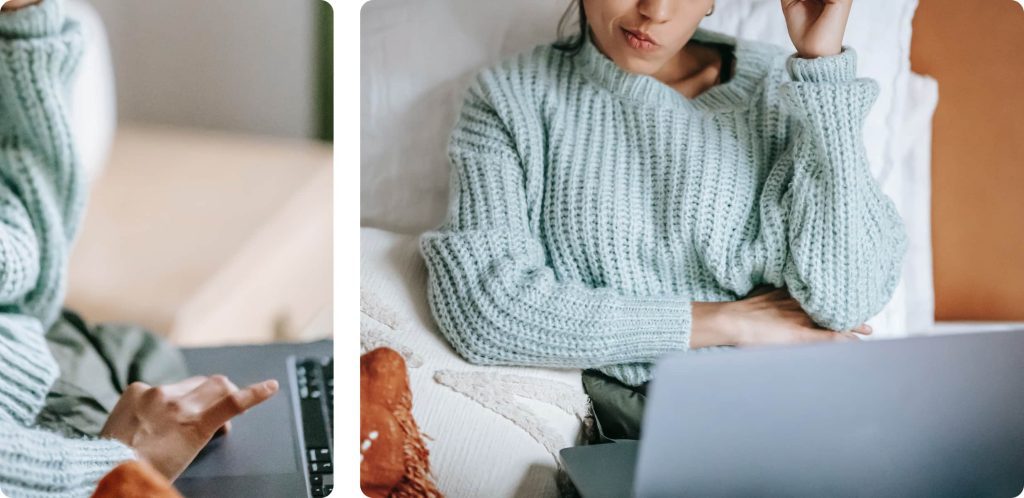 A woman thinking on her computer and typing