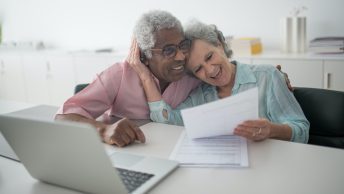 Elderly couple smiling at each others