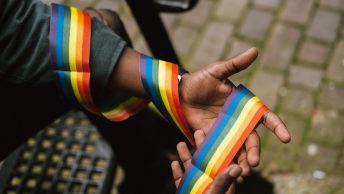Man holding pride rainbow
