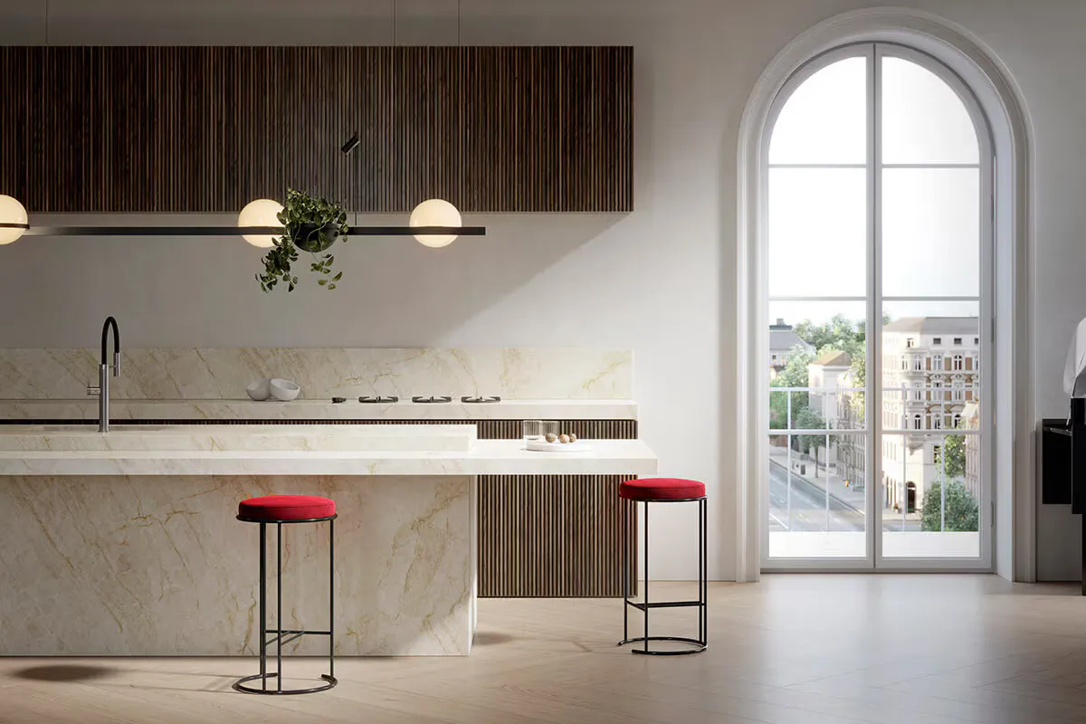 Porcelanosa kitchen with red upholstered stools