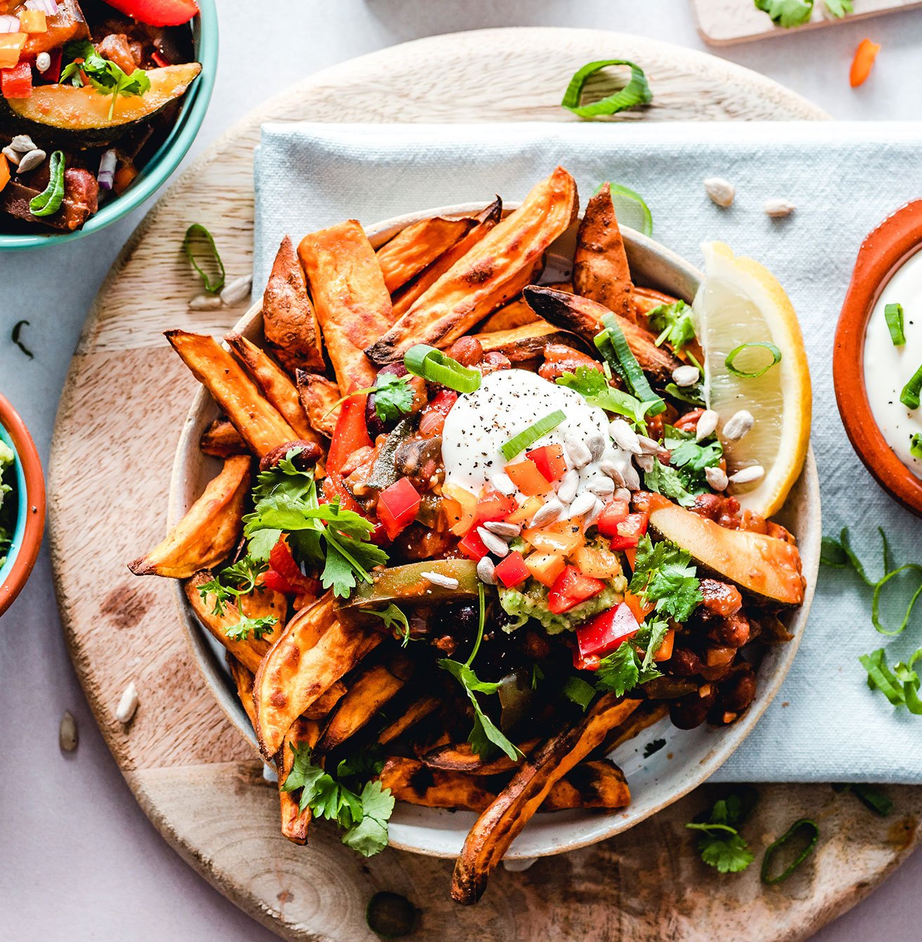 Spicy fries with vegetables salsa and melted cheese