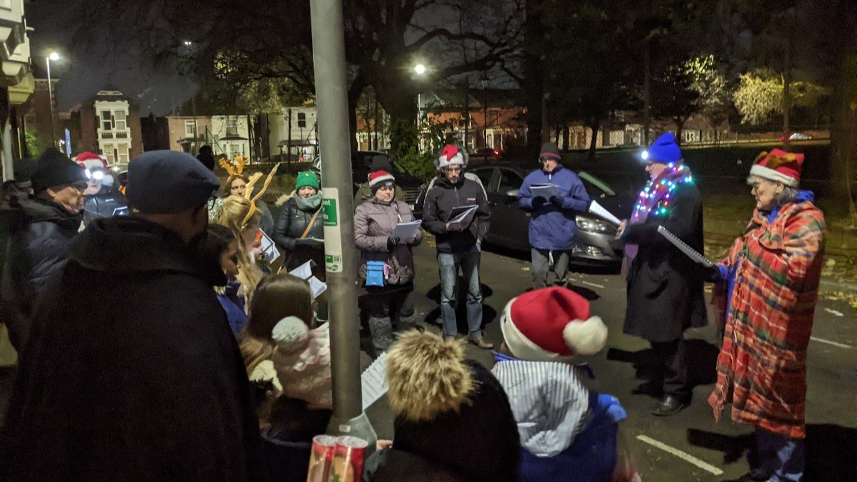 Members of our community carol singing