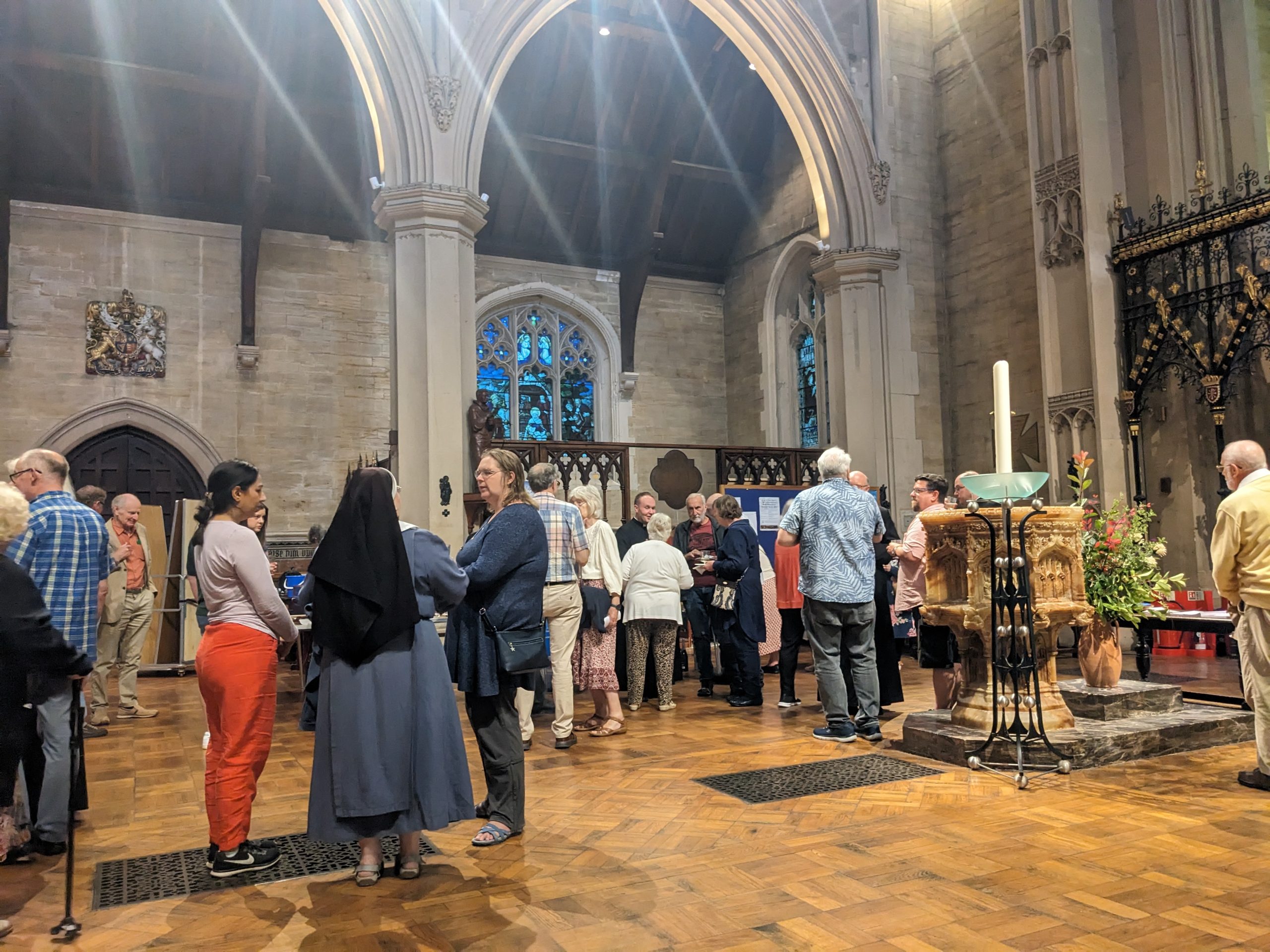 People chatting after our Patronal Mass