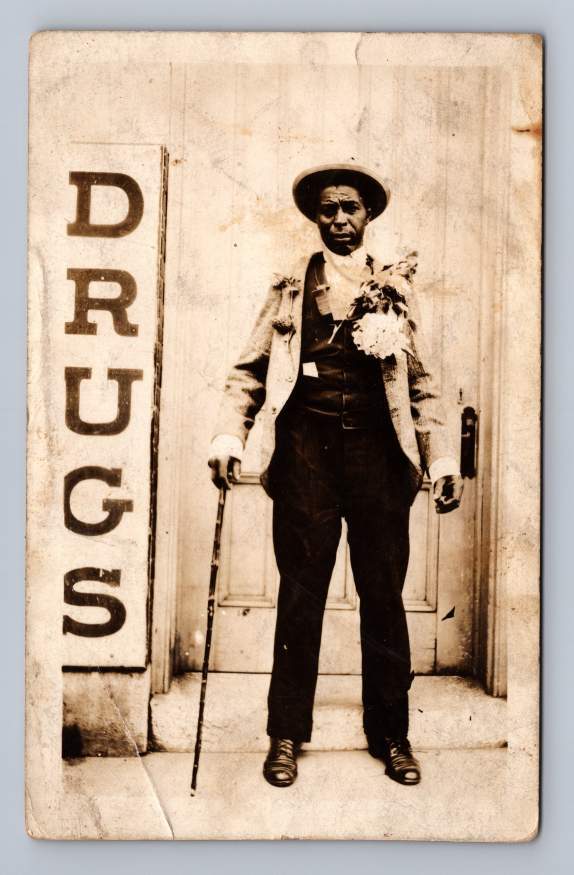 Baldwinsville New York Black Man with Giant "Drugs" Sign Real Photo Postcard