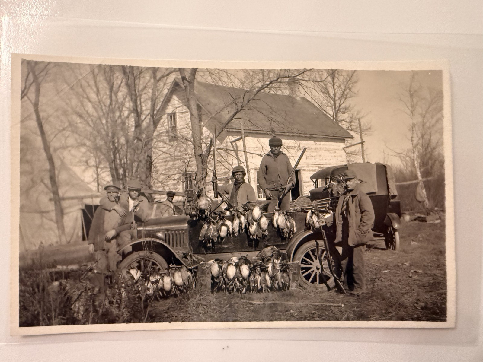 **Input:** RPPC Postcard Photo Duck Hunting Hunters Ducks Geese Shotguns Vintage Automobile

**Output:** Hunters Duck Hunting With Shotguns, Geese, And An Automobile Real Photo Postcard