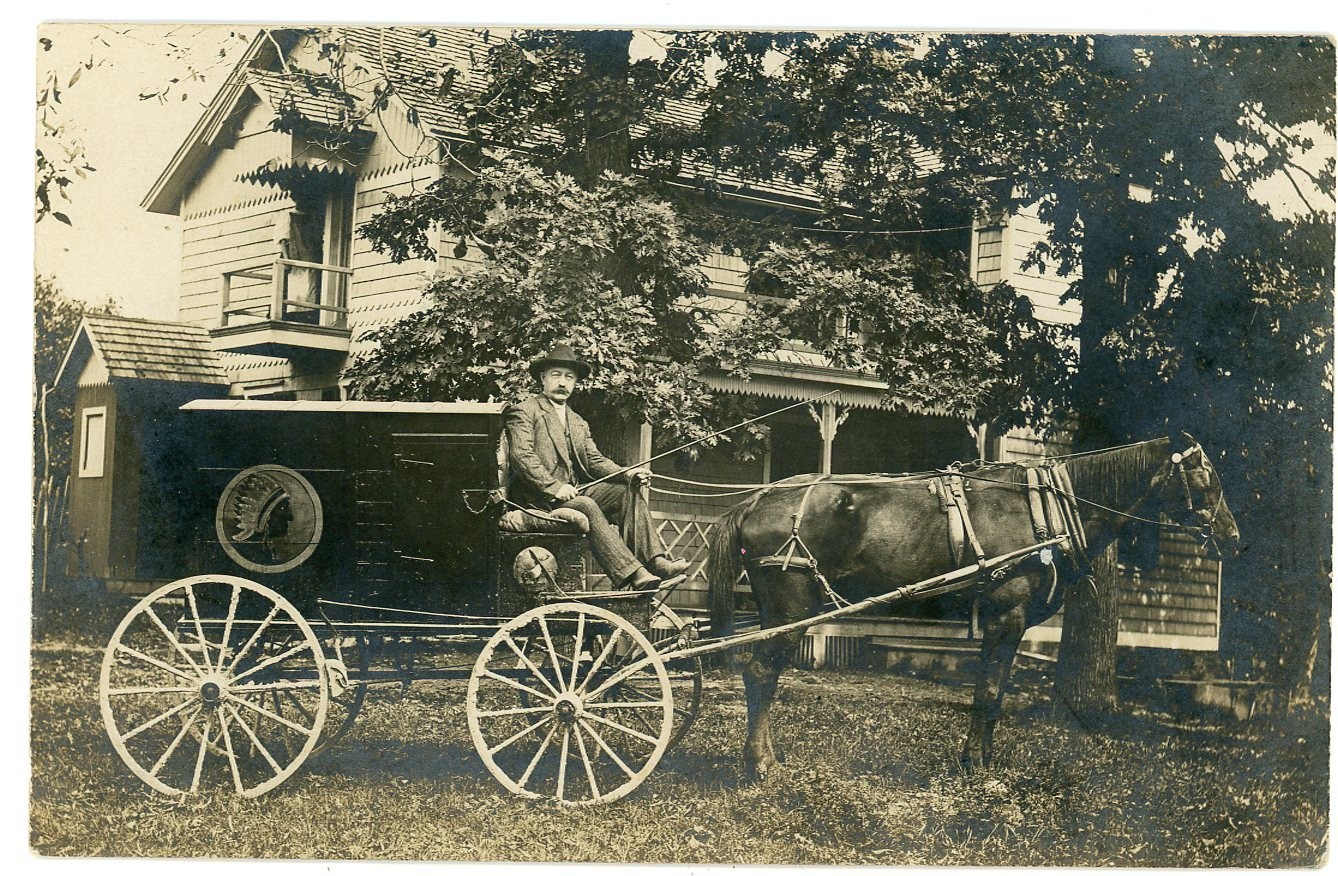 Horse Drawn Delivery Wagon With Native American Indian Chief In Headdress Emblem Real Photo Postcard