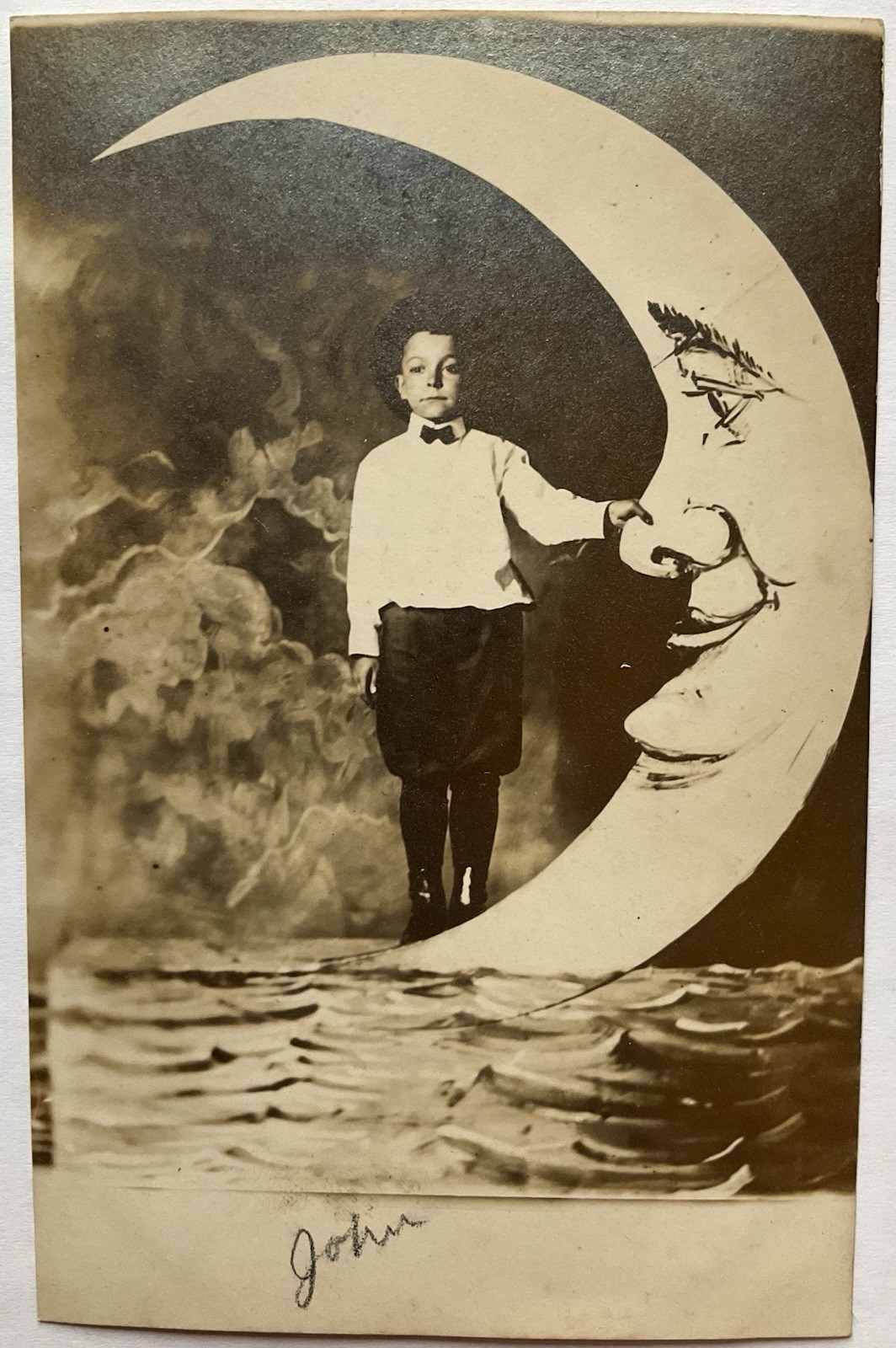 Boy Holding The Nose Of The Man In The Moon Real Photo Postcard