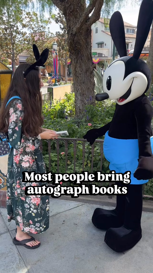 Most people bring autograph books to the Parks... but not Evey.
She brought along a beloved piece o
