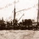 Donkey team with bales of wool unloading to ship. SAR truck. c1910