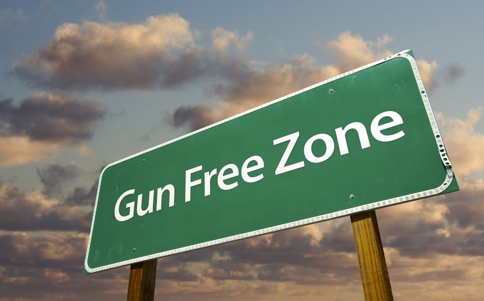 Gun free zone green sign