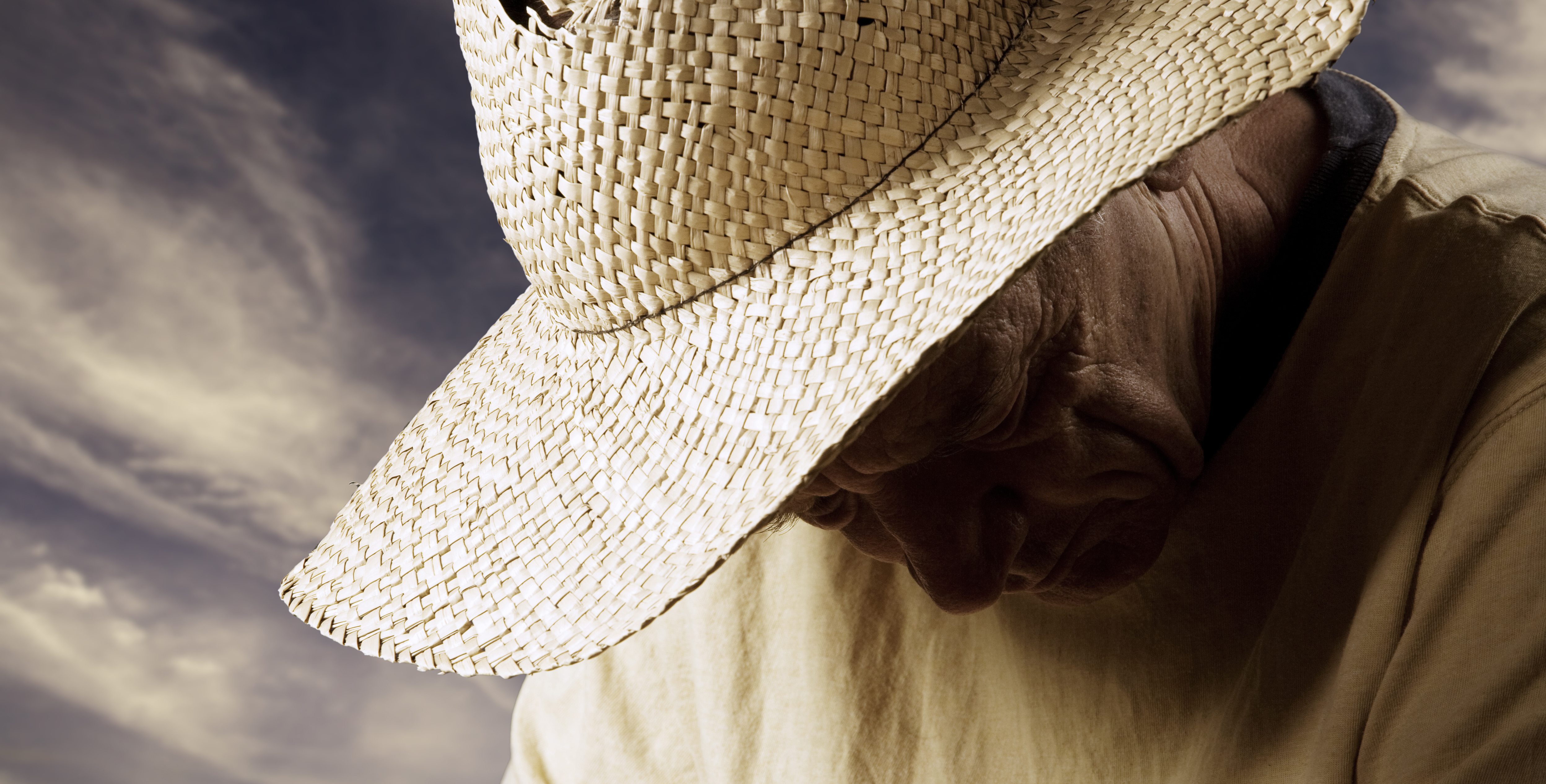 Sad man in straw hat