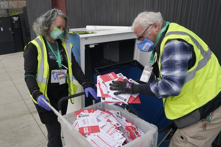 Poll workers empty voting machine
