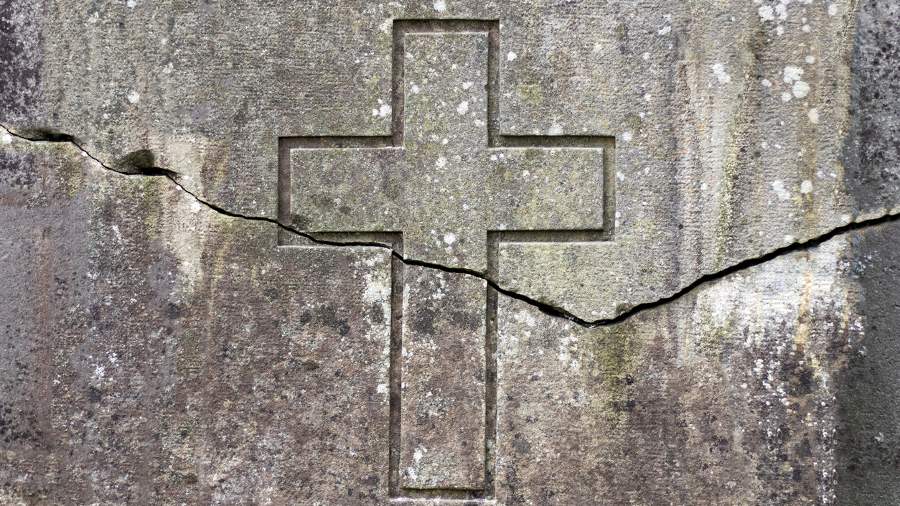Etched stone cross fractured