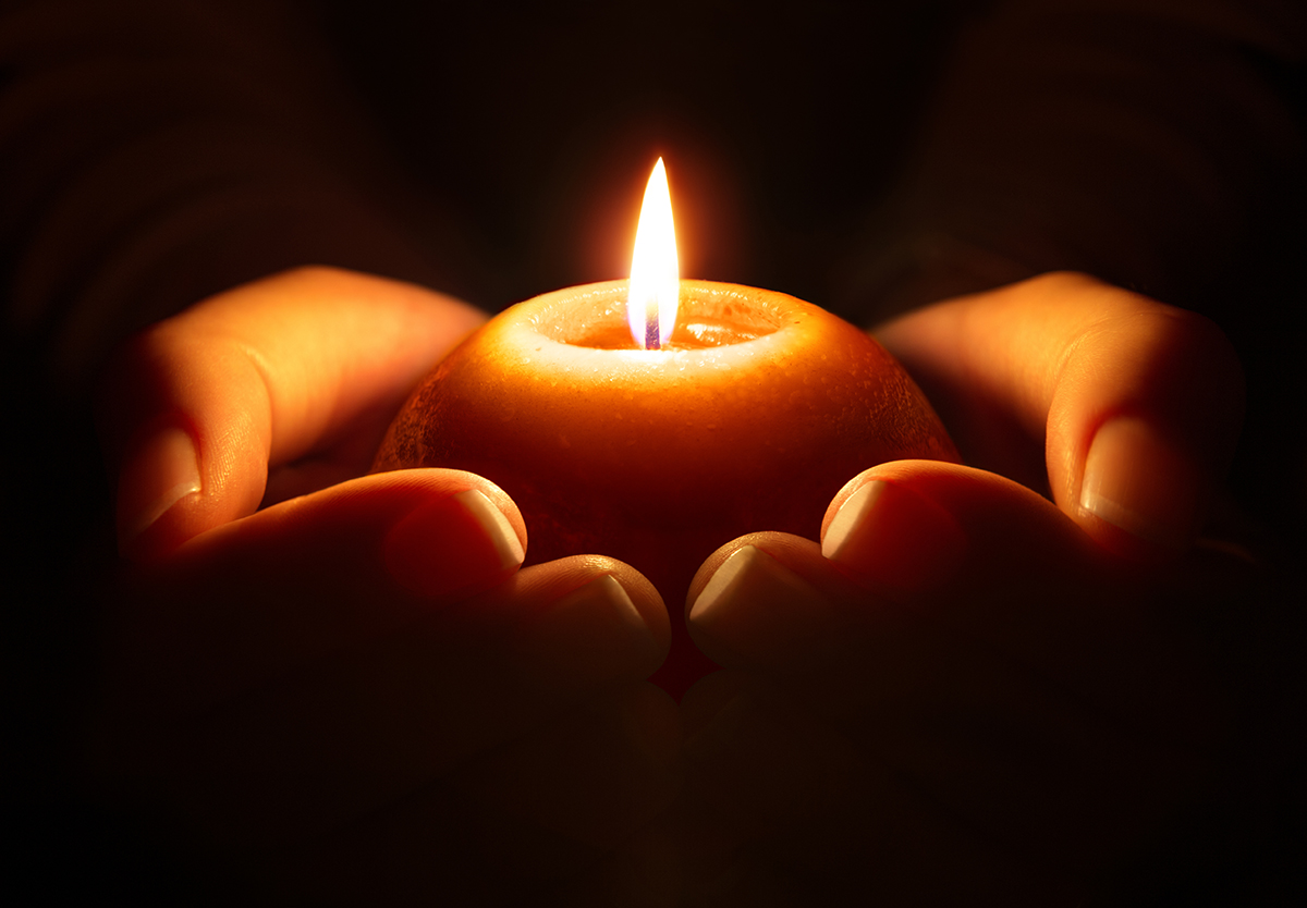 Prayer candle cupped hands