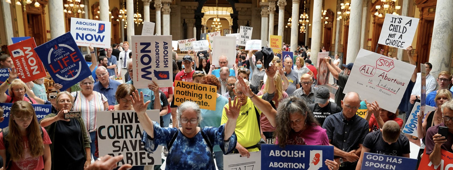 Pro life protesters pray in state capitol
