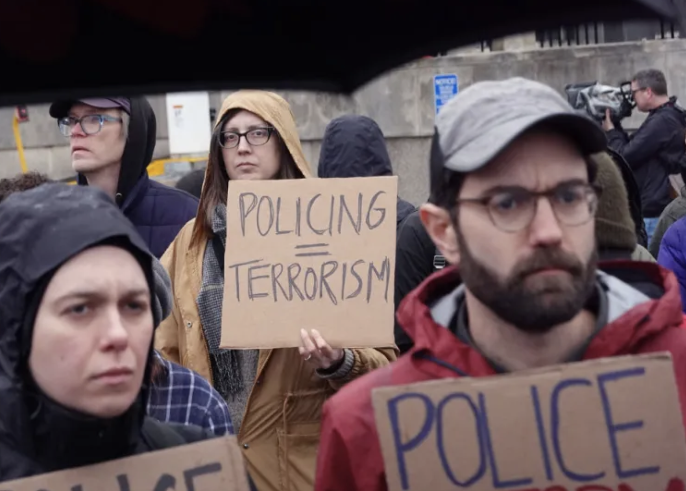 Protesters police terrorists tyre