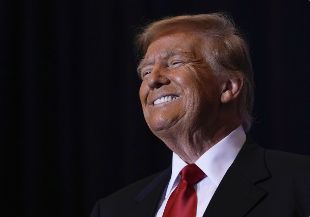 Trump huge grin side view
