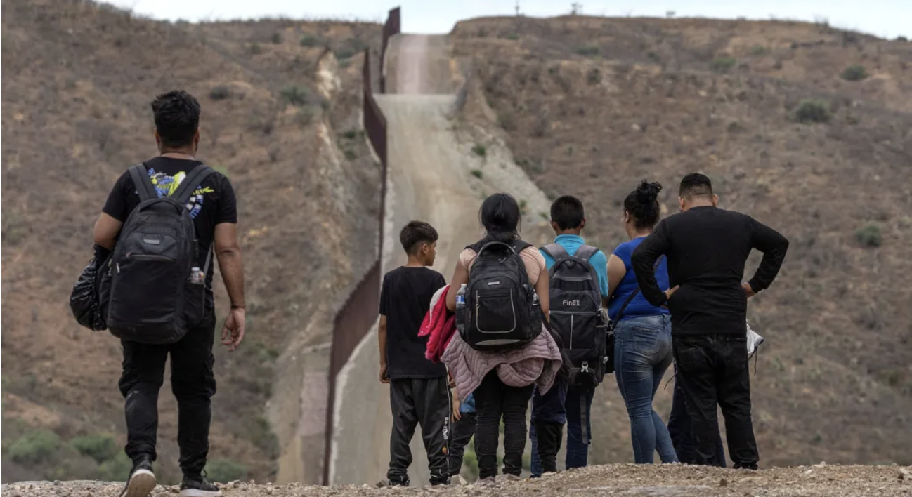 Migrants surrender to immigration officials