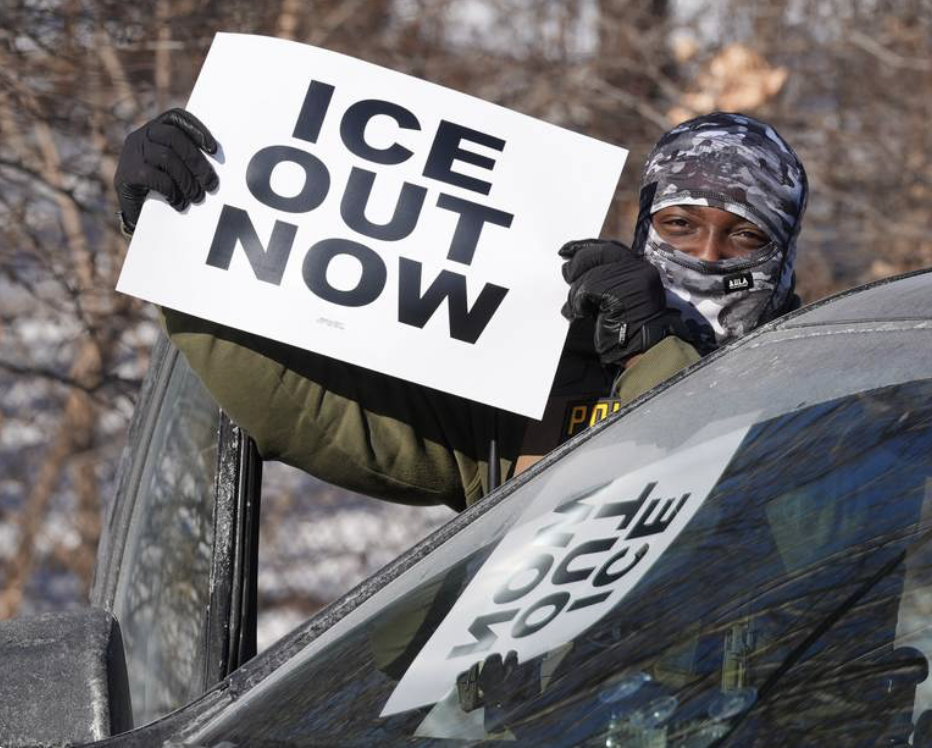 Masked anti ice protester