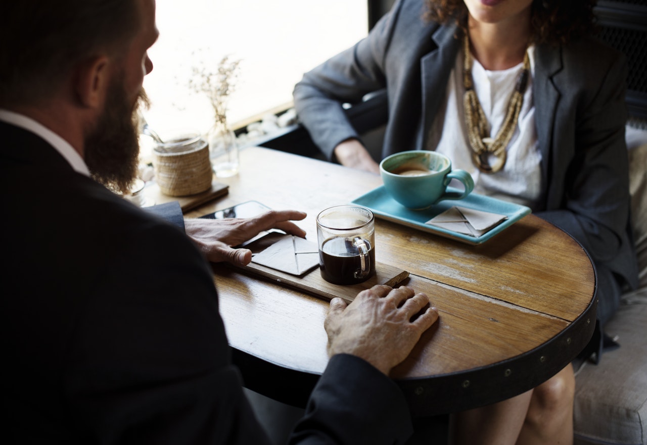 Man woman suits coffee
