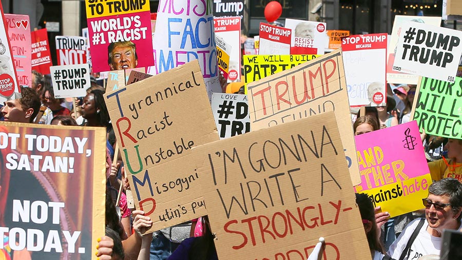 Protest trump signs london name calling 900