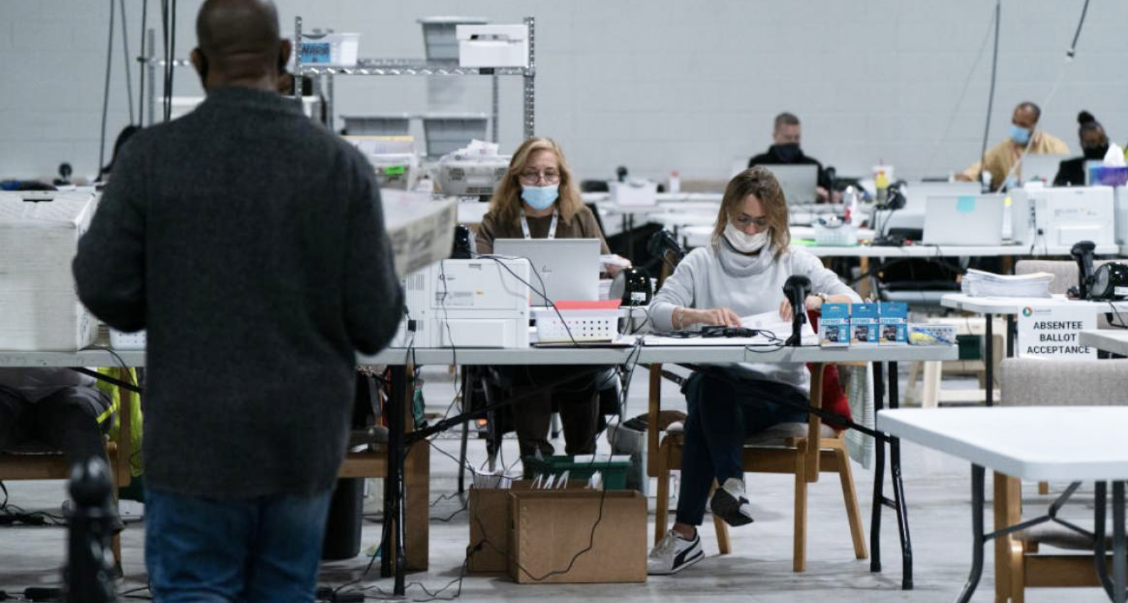 Georgia Poll Workers Pull Suitcases of Ballots Once Room is Cleared