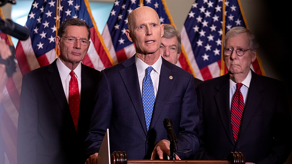 Fl sen scott talks to reporters