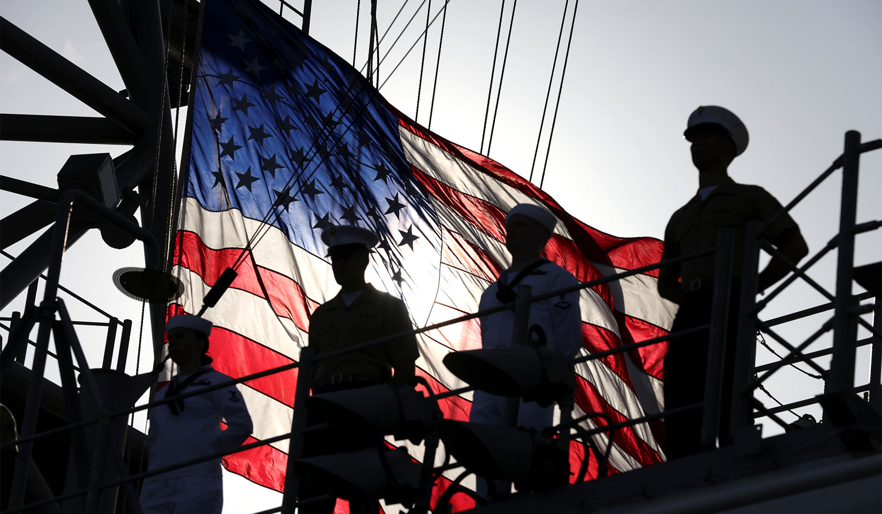 Us flag on deck with crew
