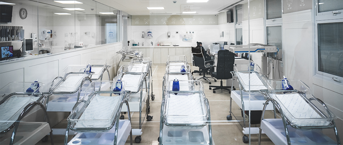Empty hospital cribs