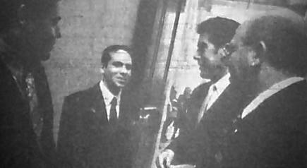 A Providence Journal photo of Nicholas Alahverdian, age 14, outside the House Chamber, with Sen. John Tassoni, Rep. Paul Moura, and Rep. Frank Montanaro, as he lobbied for more state aid to local schools