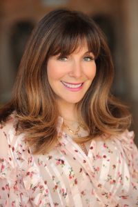 headshot photo of Mindy Weiss looking at the camera.