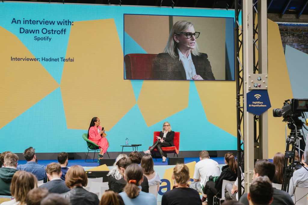 Dawn Ostroff sits on stage at the Spotify All Ears Summit during an interview in front of an audience