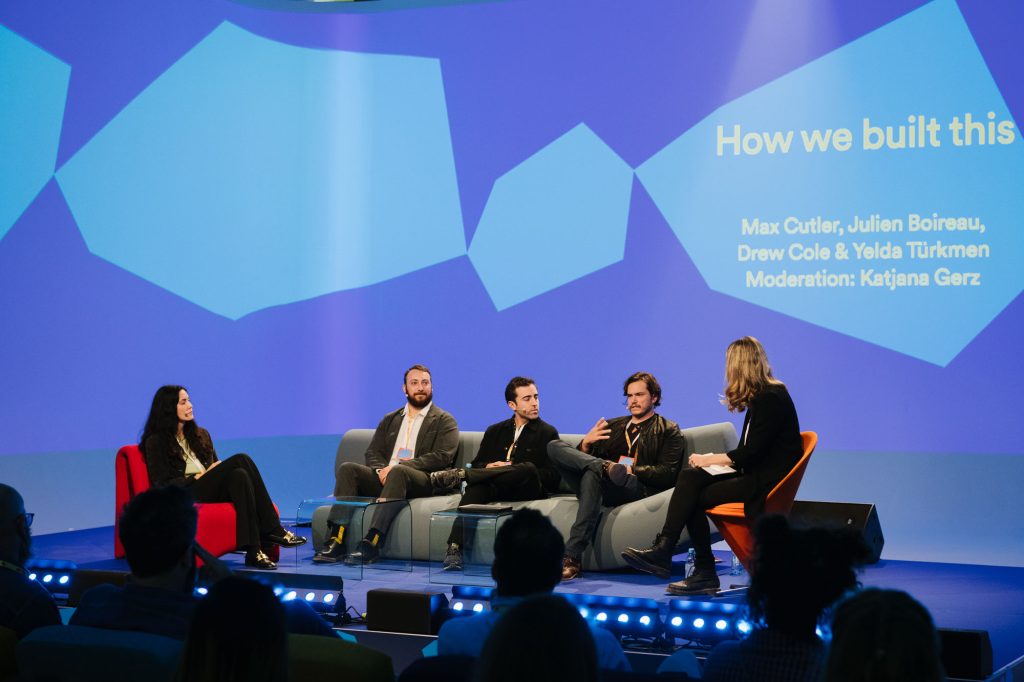 Five people sit on stage at the Spotify All Ears Summit for the panel 