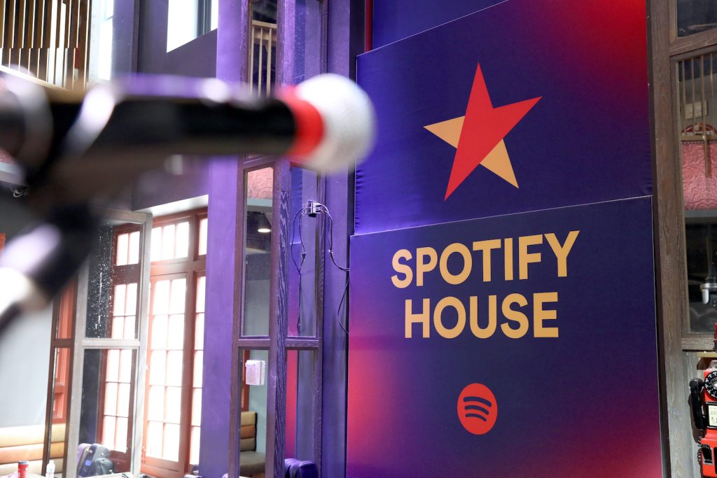 Microphone in front of Spotify House signage