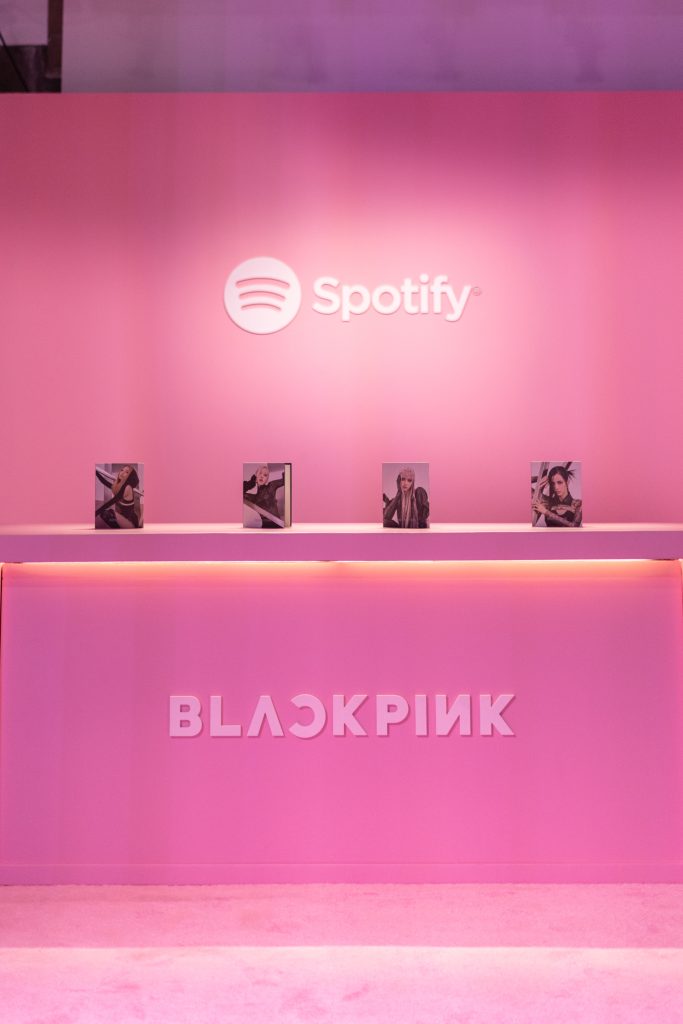 Spotify Pink Gift Card of Premium Subscription in a Hand at Store