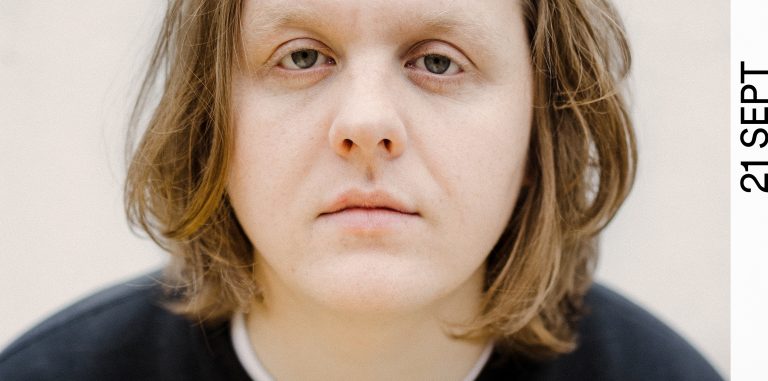 a photograph of lewis capaldi looking at the camera