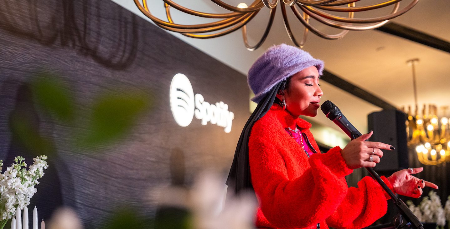 Yuna wears a red outfit while performing at Spotify Supper Singapore