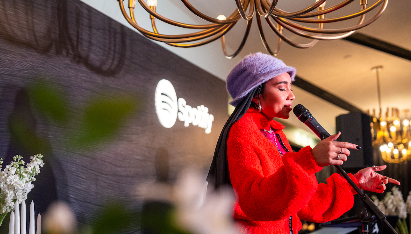 Yuna wears a red outfit while performing at Spotify Supper Singapore