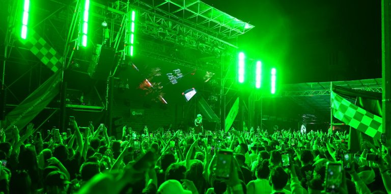 a photo of a performance on stage with a crowd cheering