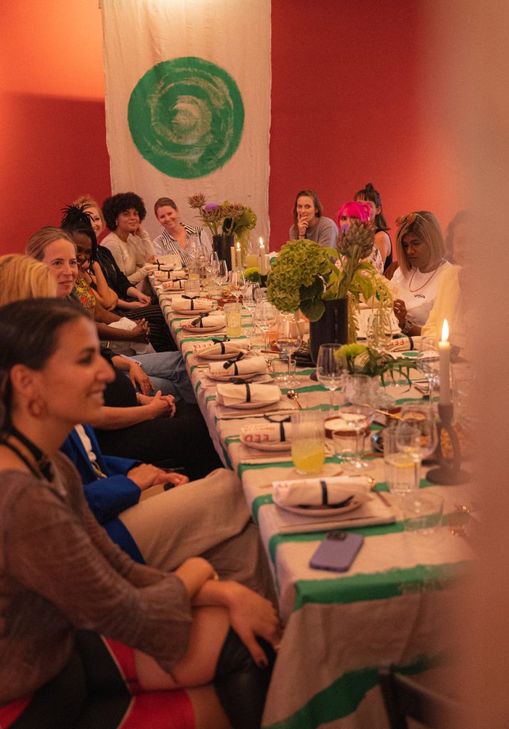 women sitting around the dinner table talking at the Spotify Equalizer dinner in Germany