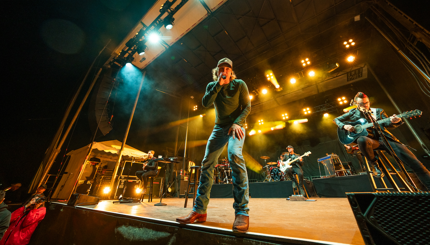 Morgan Wallen performing onstage at a show